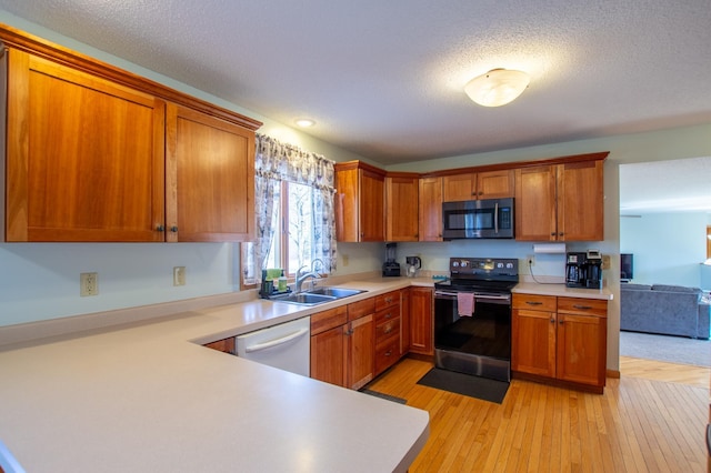 17367 Gull Lake Loop Rd NE, Bemidji, MN 56601 - kitchen featuring stainless steel microwave, electric range, a sink, white dishwasher, and light countertops