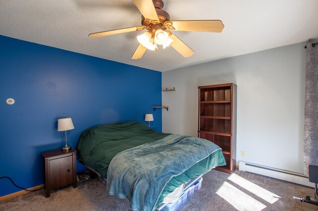 17367 Gull Lake Loop Rd NE, Bemidji, MN 56601 - carpeted bedroom with a baseboard radiator and ceiling fan