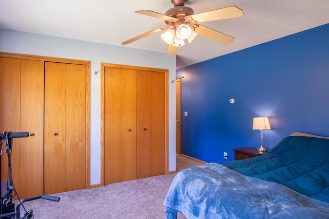 17367 Gull Lake Loop Rd NE, Bemidji, MN 56601 - bedroom with multiple closets, carpet floors, and a ceiling fan