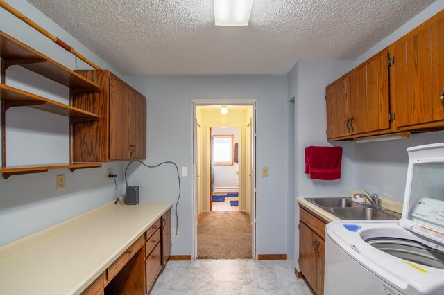 17367 Gull Lake Loop Rd NE, Bemidji, MN 56601 - laundry room with cabinet space, a textured ceiling, washer / clothes dryer, baseboard heating, and baseboards