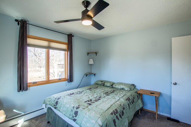 17367 Gull Lake Loop Rd NE, Bemidji, MN 56601 - bedroom with baseboard heating, carpet floors, a textured ceiling, a ceiling fan, and baseboards