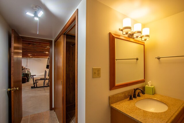 17367 Gull Lake Loop Rd NE, Bemidji, MN 56601 - bathroom with vanity, tile patterned floors, and a chandelier