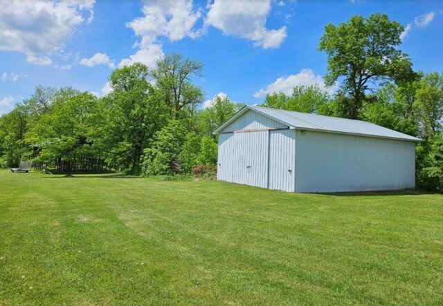 17367 Gull Lake Loop Rd NE, Bemidji, MN 56601 - view of grassy yard featuring a pole building and an outdoor structure