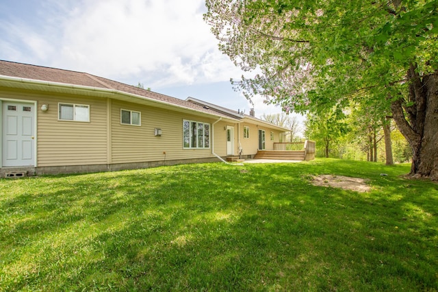 17367 Gull Lake Loop Rd NE, Bemidji, MN 56601 - back of house featuring a lawn and a wooden deck