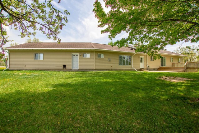17367 Gull Lake Loop Rd NE, Bemidji, MN 56601 - rear view of house with a lawn and a wooden deck