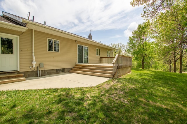 17367 Gull Lake Loop Rd NE, Bemidji, MN 56601 - rear view of property with a lawn, entry steps, and a wooden deck