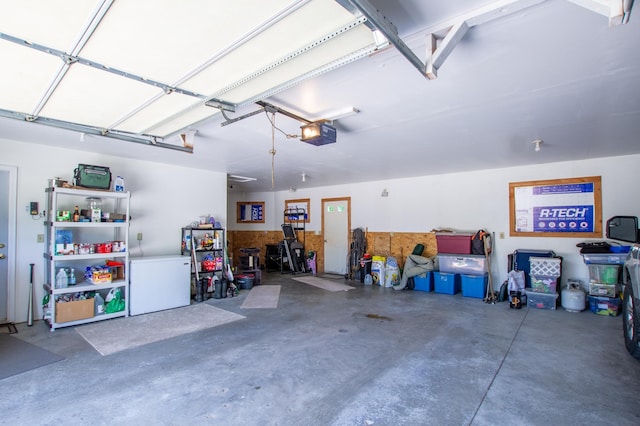17367 Gull Lake Loop Rd NE, Bemidji, MN 56601 - garage featuring fridge and a garage door opener