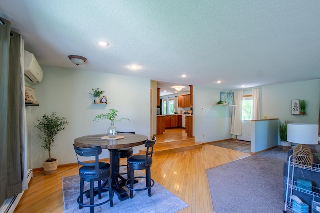17367 Gull Lake Loop Rd NE, Bemidji, MN 56601 - dining area with healthy amount of natural light, light wood-type flooring, a textured ceiling, recessed lighting, and baseboards