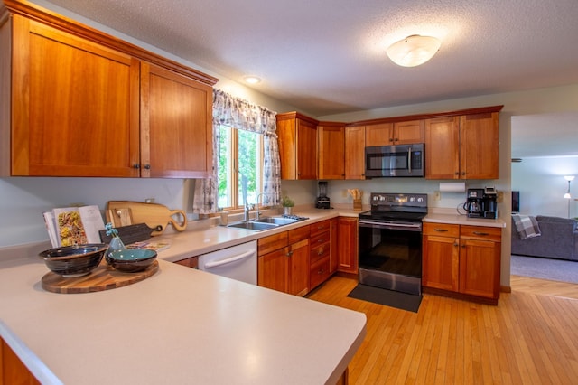 17367 Gull Lake Loop Rd NE, Bemidji, MN 56601 - kitchen featuring black / electric stove, stainless steel microwave, a sink, light countertops, and dishwasher