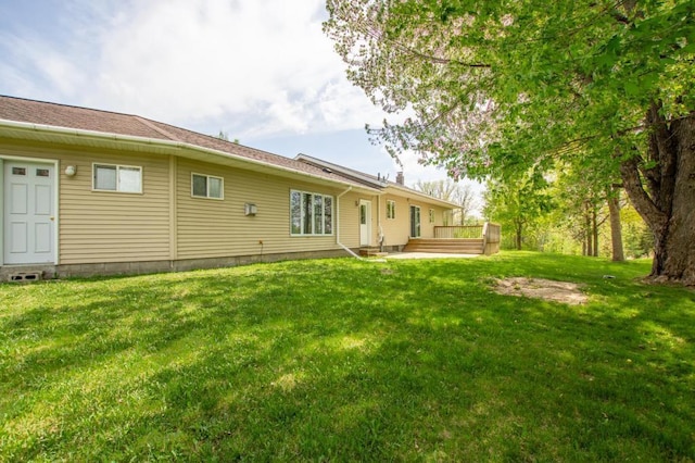 17367 Gull Lake Loop Rd NE, Bemidji, MN 56601 - back of property featuring a lawn and a wooden deck