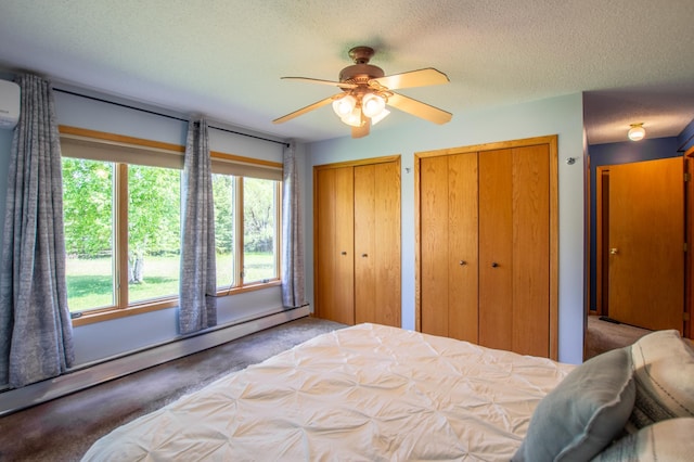 17367 Gull Lake Loop Rd NE, Bemidji, MN 56601 - carpeted bedroom with a baseboard heating unit, multiple closets, a textured ceiling, and ceiling fan