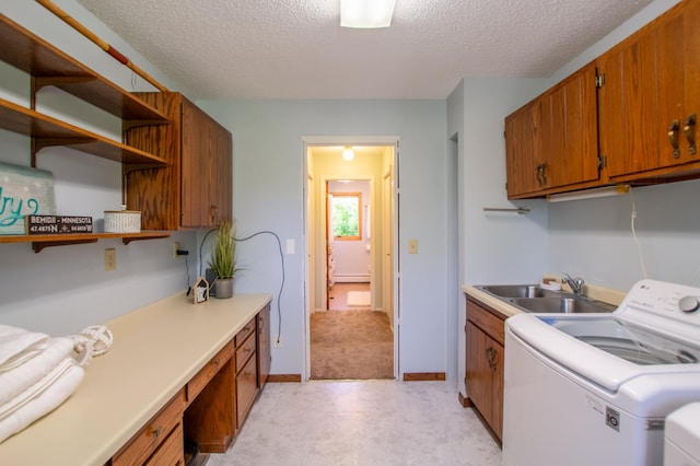 17367 Gull Lake Loop Rd NE, Bemidji, MN 56601 - laundry area with cabinet space, a textured ceiling, washing machine and dryer, a desk, and light floors