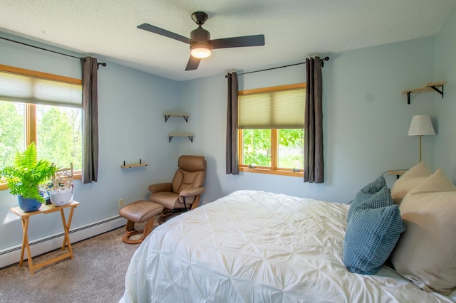 17367 Gull Lake Loop Rd NE, Bemidji, MN 56601 - bedroom with baseboard heating, carpet flooring, and a ceiling fan
