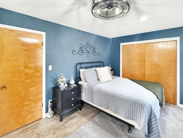 bedroom featuring baseboards and wood finished floors
