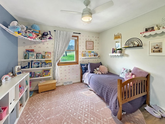 bedroom featuring crown molding, a ceiling fan, and visible vents