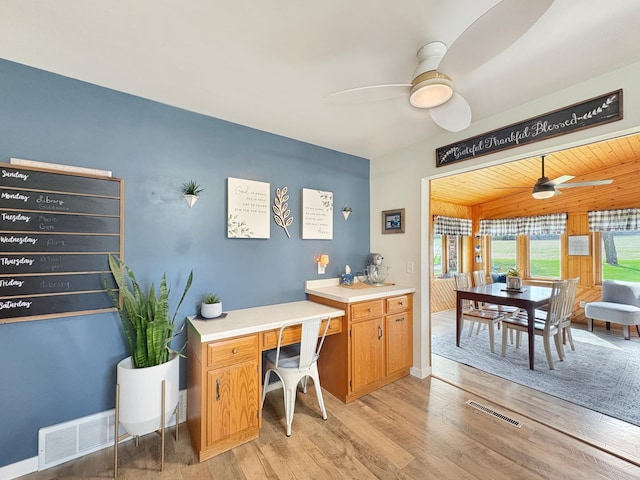 home office featuring ceiling fan, visible vents, baseboards, and light wood-type flooring