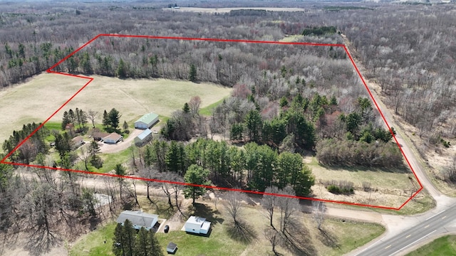 bird's eye view featuring a wooded view