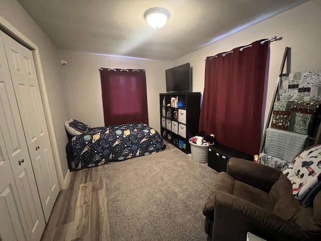 bedroom with wood finished floors