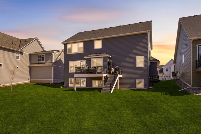 4312 Picket Way N, Woodbury, MN 55129 - back of property with stairs, a deck, and a yard