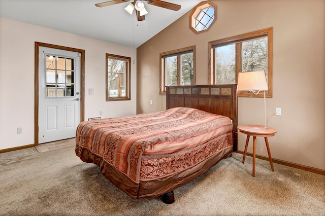 carpeted bedroom with vaulted ceiling, baseboards, and ceiling fan