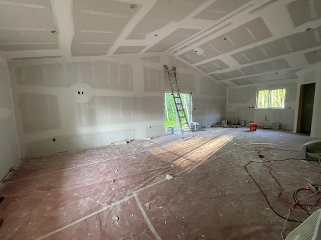 29939 Patriot Ave, Pequot Lakes, MN 56472 - unfurnished living room featuring a garage and vaulted ceiling