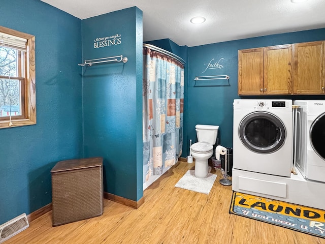 1126 US Highway 59, Garvin, MN 56132 - full bath featuring washer and dryer, wood finished floors, and a shower with curtain