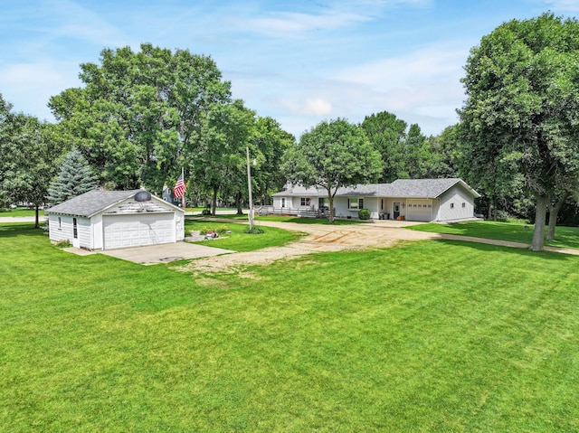 1126 US Highway 59, Garvin, MN 56132 - view of green lawn featuring an outdoor structure, a detached garage, and view of scattered trees