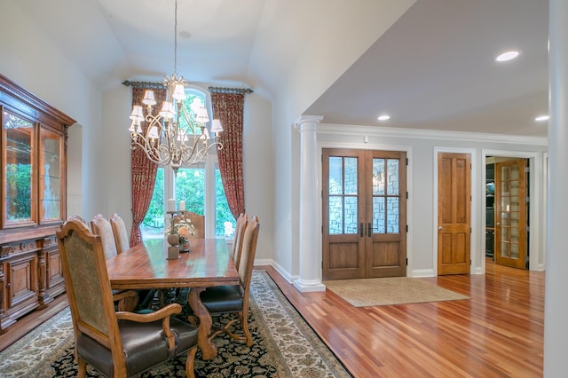 13980 Emerald Rdg, Minnetonka, MN 55305 - dining space with a chandelier, wood finished floors, french doors, vaulted ceiling, and recessed lighting