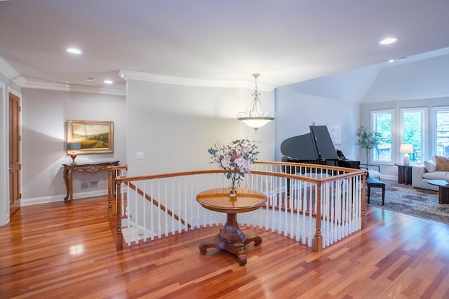 13980 Emerald Rdg, Minnetonka, MN 55305 - hall with an upstairs landing, wood finished floors, recessed lighting, and crown molding