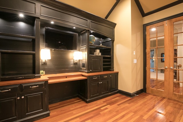 13980 Emerald Rdg, Minnetonka, MN 55305 - home office featuring french doors, light wood-style flooring, and built in study area