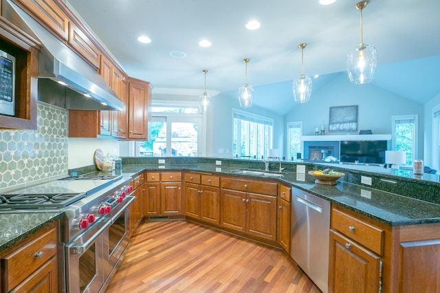 13980 Emerald Rdg, Minnetonka, MN 55305 - kitchen featuring appliances with stainless steel finishes, light wood-style flooring, brown cabinetry, pendant lighting, and recessed lighting