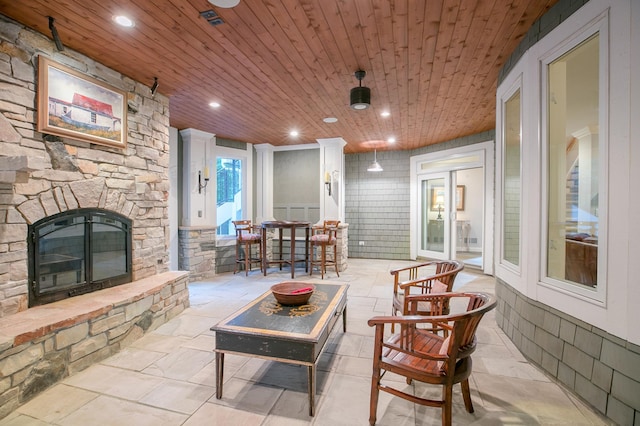 13980 Emerald Rdg, Minnetonka, MN 55305 - covered porch with a stone fireplace