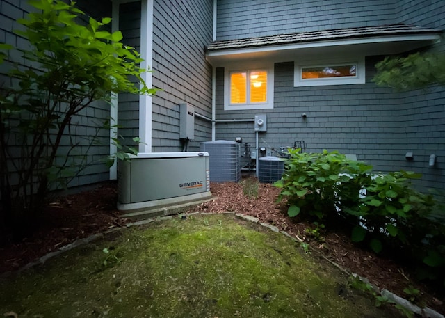 13980 Emerald Rdg, Minnetonka, MN 55305 - view of side of home featuring a central AC unit