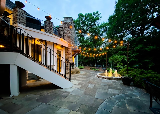 13980 Emerald Rdg, Minnetonka, MN 55305 - view of patio featuring stairway and an outdoor fire pit