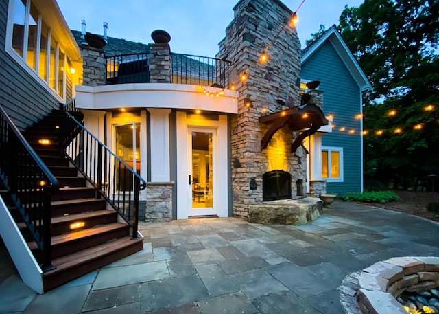 13980 Emerald Rdg, Minnetonka, MN 55305 - patio / terrace with stairway, an outdoor stone fireplace, and a patio area