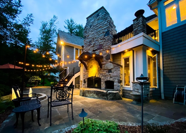 13980 Emerald Rdg, Minnetonka, MN 55305 - patio / terrace featuring an outdoor stone fireplace and a patio