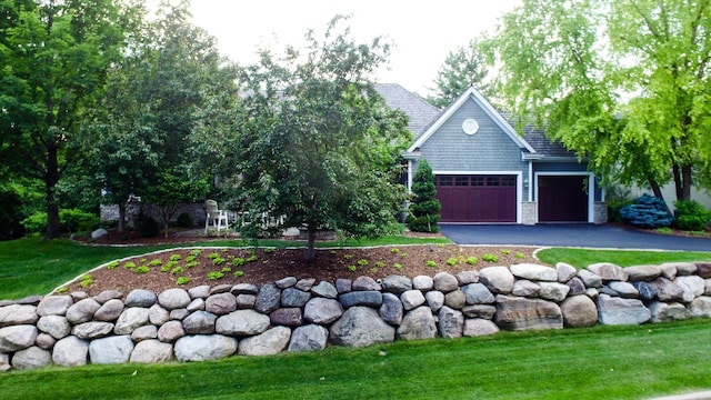 13980 Emerald Rdg, Minnetonka, MN 55305 - view of front of home featuring an attached garage, asphalt driveway, and a front lawn