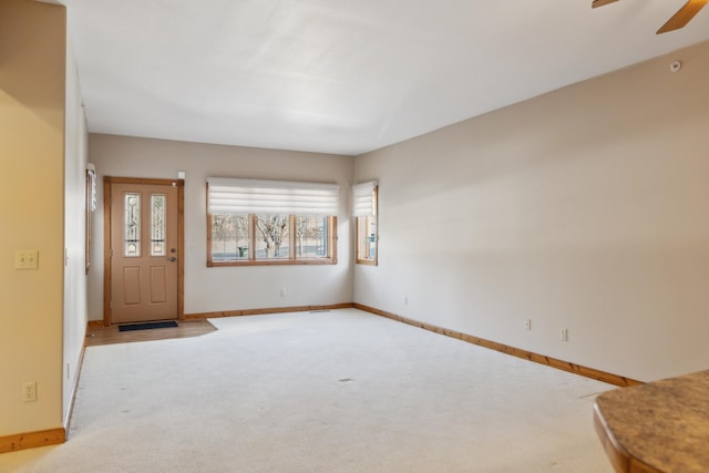 36306 Pine Bay Cir Unit 104, Crosslake, MN 56442 - carpeted foyer with baseboards and ceiling fan