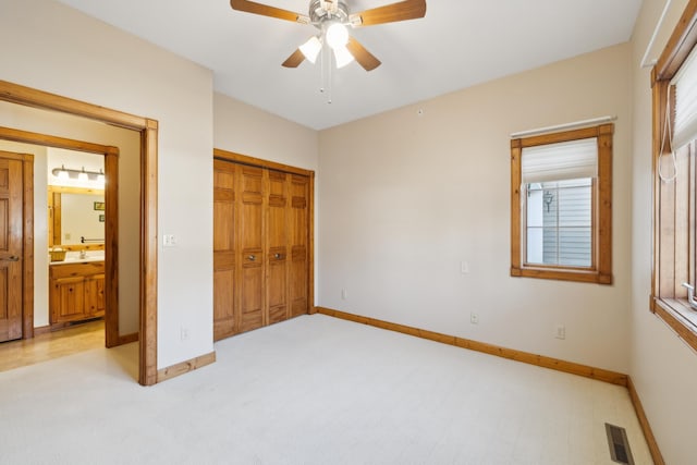 36306 Pine Bay Cir Unit 104, Crosslake, MN 56442 - unfurnished bedroom with baseboards, a closet, ceiling fan, and a sink