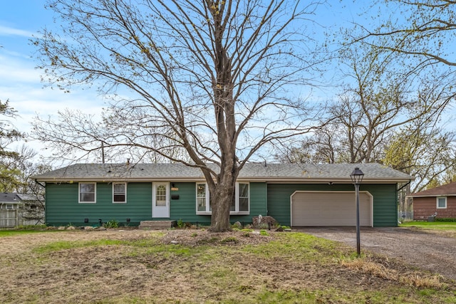 single story home with an attached garage, fence, and driveway