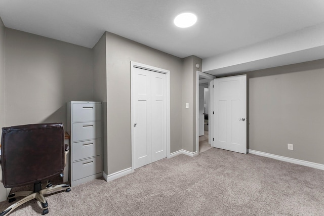 carpeted home office with baseboards