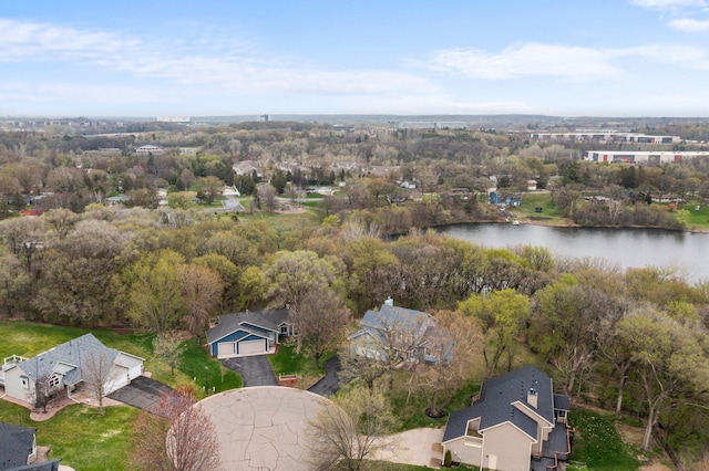 drone / aerial view featuring a residential view and a water view