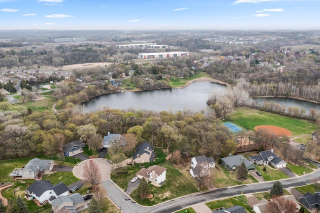 drone / aerial view with a residential view and a water view