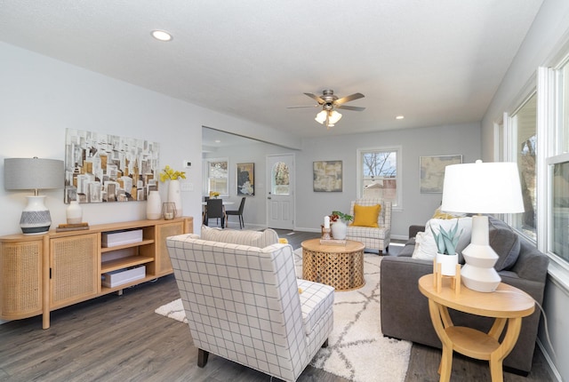 living room featuring recessed lighting, ceiling fan, baseboards, and wood finished floors