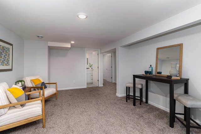 sitting room featuring baseboards, recessed lighting, and carpet