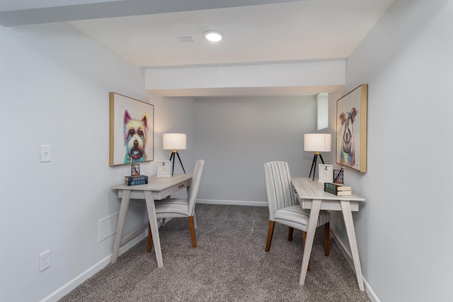 carpeted office space with visible vents and baseboards