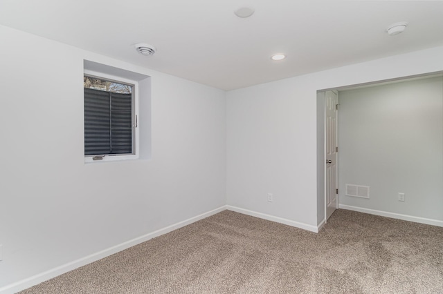 empty room with recessed lighting, carpet flooring, visible vents, and baseboards