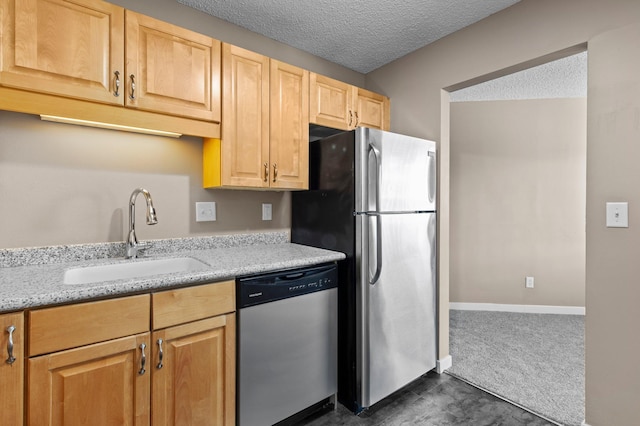 78 10th St E Unit 1410, Saint Paul, MN 55101 - kitchen featuring appliances with stainless steel finishes, a sink, a textured ceiling, light stone counters, and light brown cabinets
