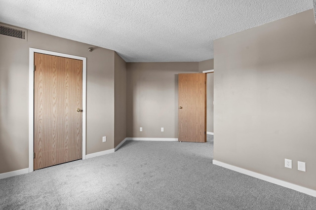78 10th St E Unit 1410, Saint Paul, MN 55101 - unfurnished bedroom featuring carpet, a textured ceiling, and baseboards
