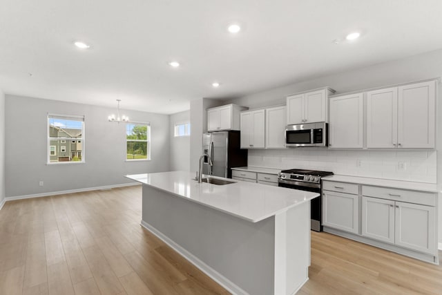1543 Traverse Ln W, Saint Paul, MN 55118 - kitchen with stainless steel appliances, a sink, tasteful backsplash, light wood-type flooring, and recessed lighting